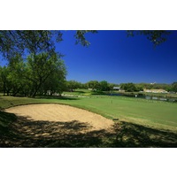 The par-3 eighth hole on the Oaks nine at Hill Country Golf Club is well protected. 