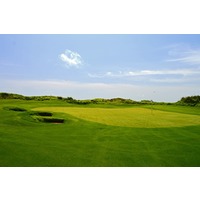 Pot bunkers guard the left side of the green on the par-4 12th hole at Palmilla Beach Golf Club in Port Aransas.
