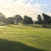A sunny day view of a hole at Gaines County Golf Course.