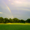 A view of rainbow over the 7th green at Sunset Golf Club
