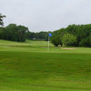 A view of green #18 with #10 in background at Cross Timbers Golf Course