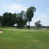 A view of a green with water in background at Keeton Park Golf Course.