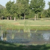 A view over the water of green at Texas Woman's University Golf Course