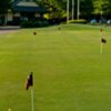 A view of the clubhouse and putting green at Iron Horse Golf Course