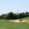 A view of the 18th green protected by bunkers at Cowboys Golf Club