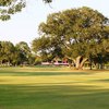 A view from fairway with clubhouse in background at Pine Forest Country Club