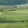 A view of green with bunker on the left at Raven Nest Golf Club