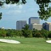 A view of a green flanked by bunkers at Las Colinas Country Club.