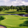 A view of green #7 surrounded by water at Riverhill Country Club