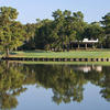 A view of a green surrounded by water at Island Course from Kingwood Country Club..