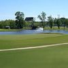 A view of the 18th hole with water coming into play at Oak Forest Country Club