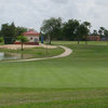 A view of a green with water coming into play from the left side at Eighteen Hole Course from Shary Municipal Golf Club.