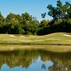 A view over the water of a green at Quail Valley Golf Course
