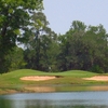 A view over the water of green protected by bunkers (courtesy of River Pointe Golf Club)