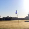 A sunny view of a hole at Lone Cedar Country Club