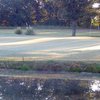 A view over the water of green at Lone Cedar Country Club