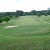 A view of a green and a fairway at Meadowbrook Country Club