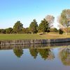 A view over the water of a hole at Green Tree Country Club