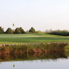 A view over the water of green at Midland Country Club