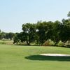 A view of green guarded by sand trap at James Connally Golf Course