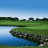 A view of green surrounded by water at Lakecliff Country Club