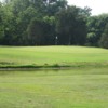 A view of the 14th green protected by water at Webb Hill Country Club