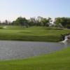 A view over the water of a green at Harbor Lakes Golf Club