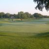 A view of a green a and a fairway at Dallas Athletic Club