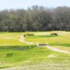 A view over the water of green #9 at Bosque Valley Golf Course