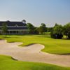 A view of a green protected by a large bunker at Tangle Ridge Golf Club