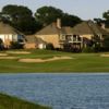 A view of a green surrounded by a collection of bunkers at Twin Creeks Golf Course