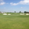 A view of a green protected by two pairs of bunkers on each side at WestRidge Golf Course