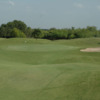 A view of a green protected by bunkers at Tierra Santa Golf Club