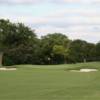 View of a green with two bunkers at The Golf Club of Dallas