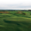 A view of two greens at Trinity Forest Golf Club