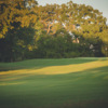 Sunset view of a green at City Course at The Phillips Event Center