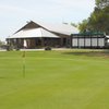 A view of the 18th green with clubhouse in background at Delaware Springs Golf Course