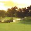 A view of a green with water coming into play  at Bear Creek Golf Club