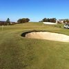 A view of the putting green and practice bunker at Timberlinks Golf Club.