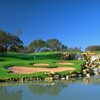 A view over the water of green #9 at Waterchase Golf Course