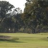 A view of a green protected by bunkers at Grand Oaks Golf Club