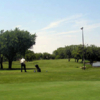 A sunny day view of a tee at Willow Creek Golf Center.