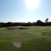 A sunny day view of a green at Tony Butler Golf Course.