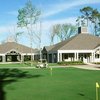 A view of the putting green with clubhouse in background at Eagle Pointe Golf Club