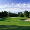 A view of green protected by bunkers at Falls Resort & Country Club