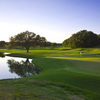 A view of a green with water coming into play from left at Hill Country Golf Club