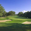 A view of a green protected by bunkers at Hill Country Golf Club