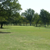 A sunny day view of a green at Rolling Oaks Golf Club.