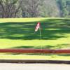 A sunny day view of a green at Hilltop Country Club.