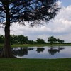 A view over the water of green at The Golf Club of Seguin